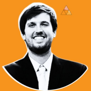 Black and white image of a smiling person in a suit and tie against an orange background with a small triangle design above.