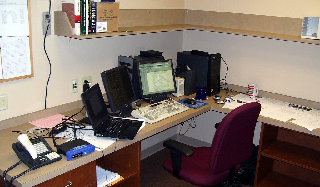 Business office desk representing connected software systems used in CRM integration