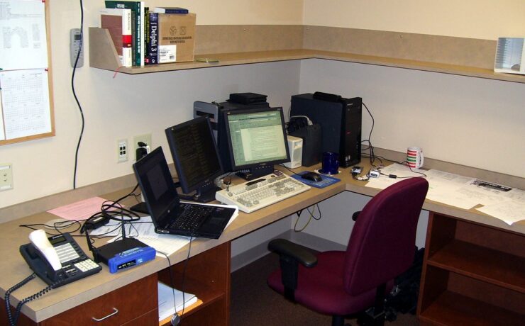 Business office desk representing connected software systems used in CRM integration