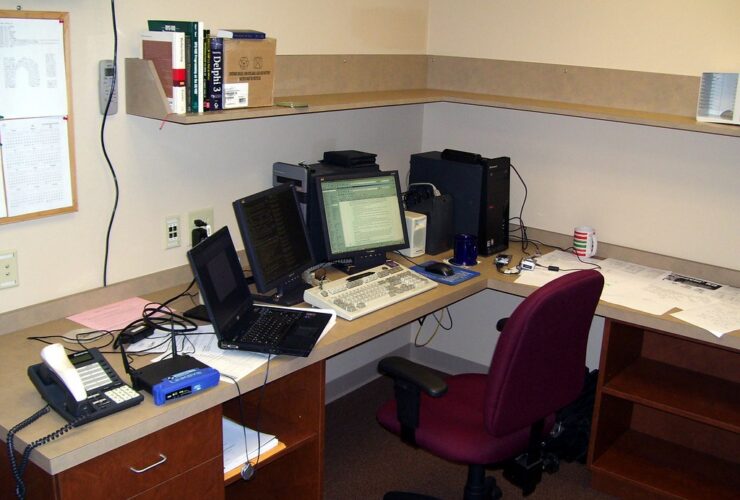 Business office desk representing connected software systems used in CRM integration